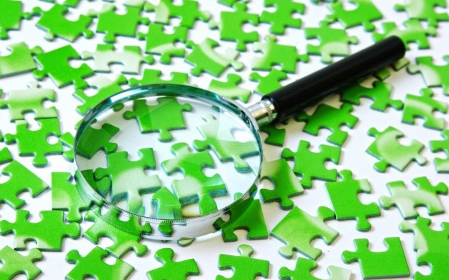 magnifying glass on the green puzzle