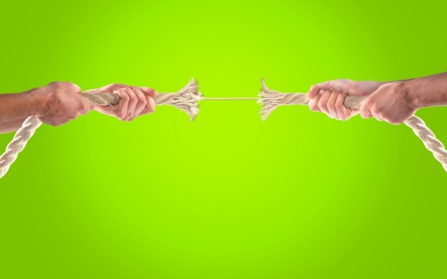 Hands of people pulling the rope. Cooperation concept