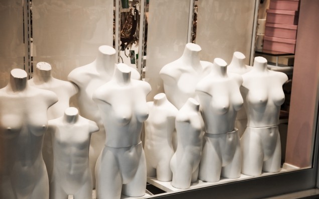Naked mannequin in a shop window.