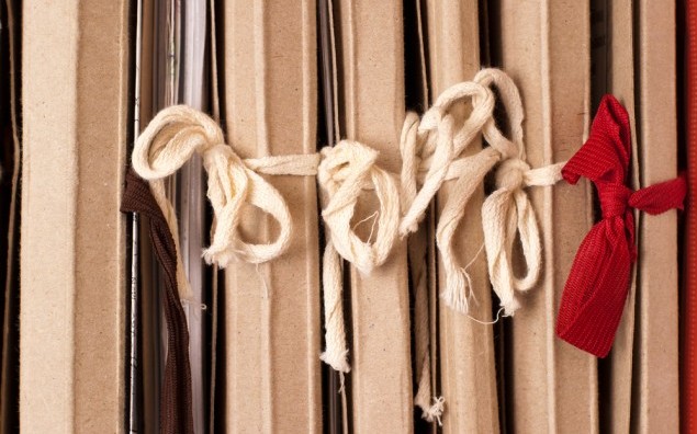 Archival documents folders, roped in the bows