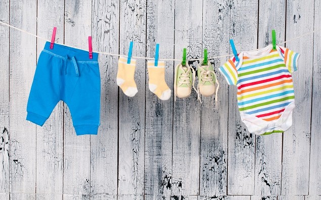 Baby clothes hanging on the clothesline.