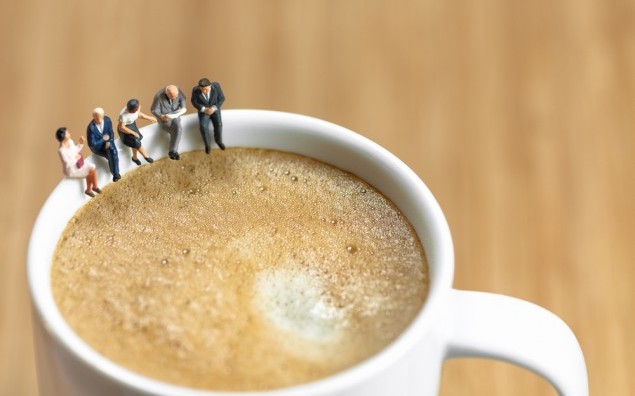 Miniature business team having a coffee break