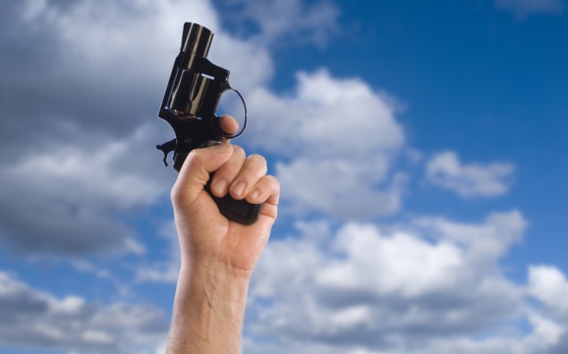 hand firing line of a race with sky background