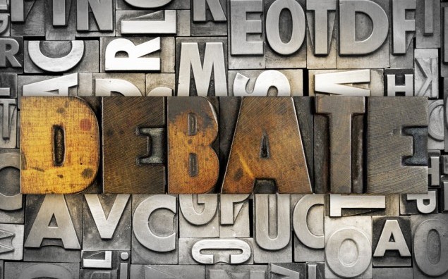 The word DEBATE written in vintage letterpress type