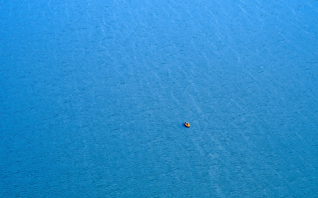 Life raft on sea background.