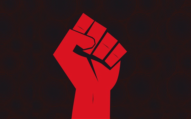 Clenched fist hand held high in protest on seamless background.