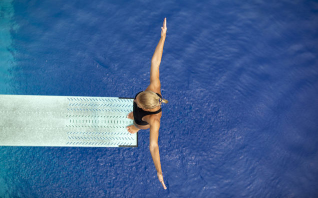 girl standing on diving board