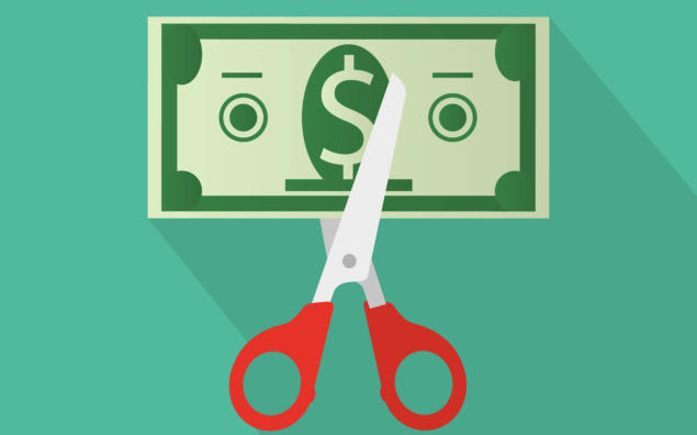 Scissors cutting money bill. vector illustration in flat design on green background with long shadow