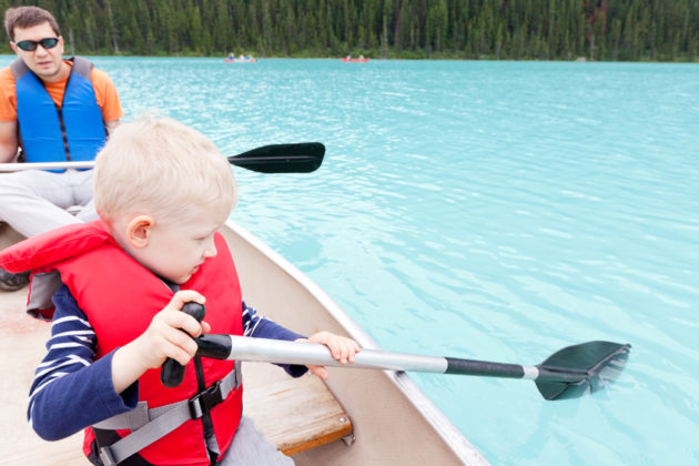 father and son on a lake louise