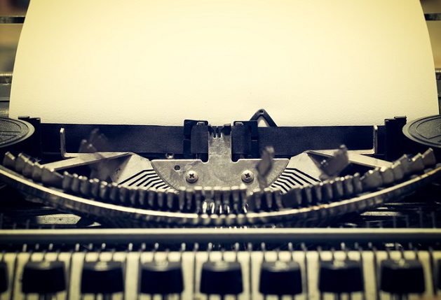 Words "begin" written with old typewriter